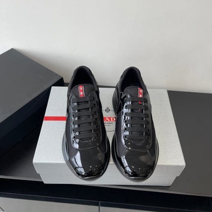 PRADA SNEAKER 25S IN BLACK MESH AND PATENT CALFSKIN