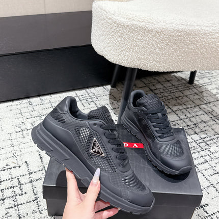 PRADA 25S MEN SNEAKERS IN BLACK CANVAS
