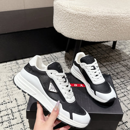 PRADA 25S MEN SNEAKERS IN BLACK AND WHITE CANVAS