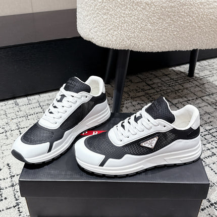PRADA 25S MEN SNEAKERS IN BLACK AND WHITE CANVAS