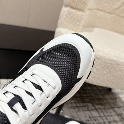 PRADA 25S MEN SNEAKERS IN BLACK AND WHITE CANVAS
