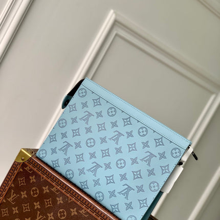 POCHETTE VOYAGE 26 IN SKY BLUE MONOGRAM ECLIPSE CALFSKIN