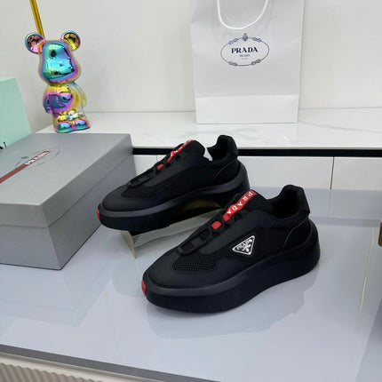 PRADA 25S CROSS LACED SNEAKERS IN BLACK CALFSKIN