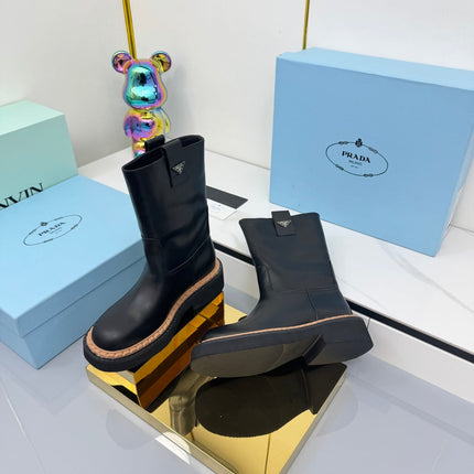PRADA 25S HIGH MARTIN BOOTS 50MM IN BLACK CALFSKIN
