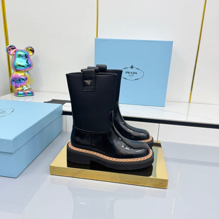 PRADA 25S HIGH MARTIN BOOTS 50MM IN BLACK GLOSSY CALFSKIN