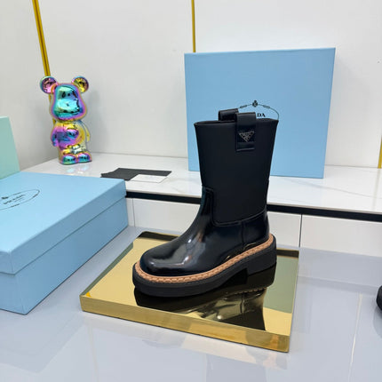 PRADA 25S HIGH MARTIN BOOTS 50MM IN BLACK GLOSSY CALFSKIN