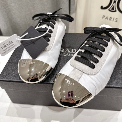 PRADA 25S MULES IN WHITE WITH METAL TOECAP