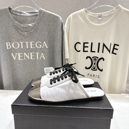 PRADA 25S MULES IN WHITE WITH METAL TOECAP