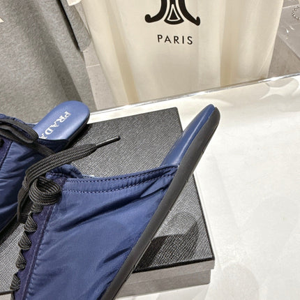 PRADA 25S MULES IN DARK BLUE WITH METAL TOECAP