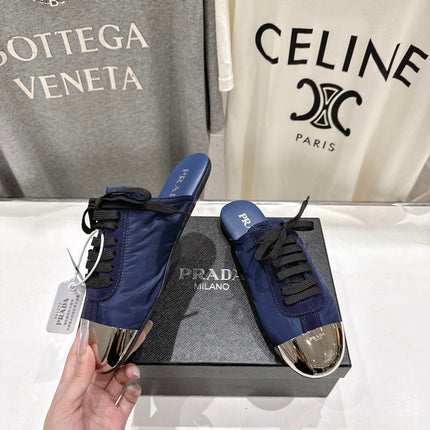 PRADA 25S MULES IN DARK BLUE WITH METAL TOECAP