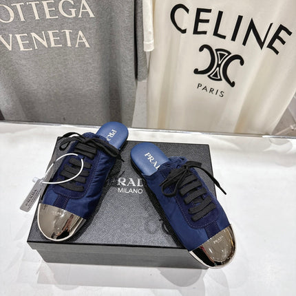 PRADA 25S MULES IN DARK BLUE WITH METAL TOECAP