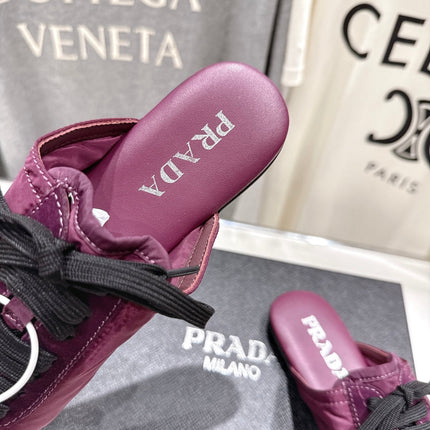 PRADA 25S MULES IN PLUM WITH METAL TOECAP
