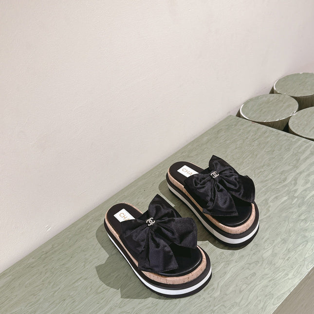 CC SLIPPERS WITH SILK BOW IN BLACK COWHIDE