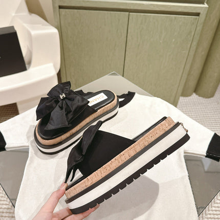 CC SLIPPERS WITH SILK BOW IN BLACK COWHIDE