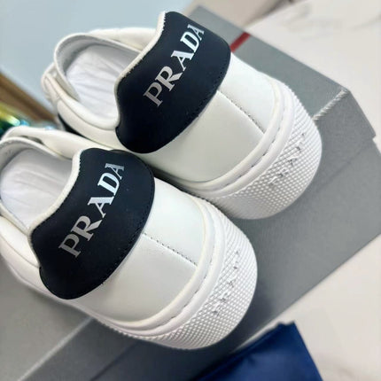 PRADA 25S LEATHER LOGO OUTLET SNEAKERS BLACK AND WHITE CALFSKIN