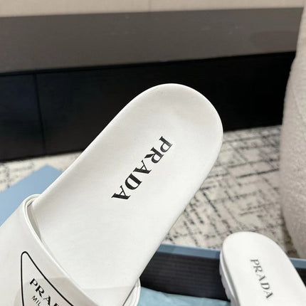 PRADA 25S RUBBER SLIDE IN WHITE CALFSKIN WITH LOGO
