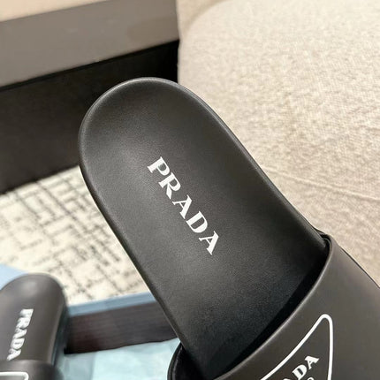 PRADA 25S RUBBER SLIDE IN BLACK CALFSKIN WITH LOGO