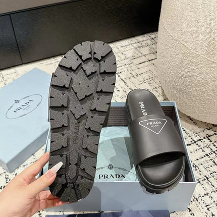 PRADA 25S RUBBER SLIDE IN BLACK CALFSKIN WITH LOGO