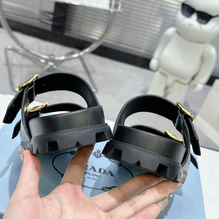 PRADA 25S STRAP SLIDES 30MM IN BLACK CALFSKIN GOLD HARDWARE