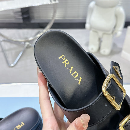 PRADA 25S STRAP SLIDES 30MM IN BLACK CALFSKIN GOLD HARDWARE
