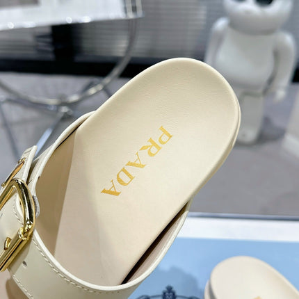 PRADA 25S STRAP SLIDES 30MM IN CREAM CALFSKIN GOLD HARDWARE