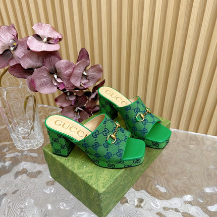 HORSEBIT SLIDE SANDAL IN FOREST GREEN MONOGRAM CANVAS AND SHEEPSKIN LINING