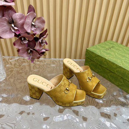 HORSEBIT SLIDE SANDAL IN GOLD MONOGRAM CANVAS AND SHEEPSKIN LINING