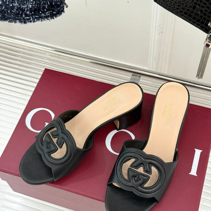 MID-HEEL MULE IN BLACK CALFSKIN