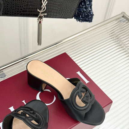 MID-HEEL MULE IN BLACK CALFSKIN