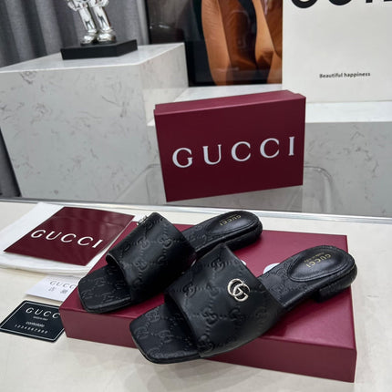 GG CASUAL SLIPPERS IN BLACK CALFSKIN LOGO EMBOSSING