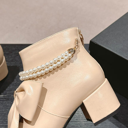 SHORT BOOTS IN BISQUE CREAM SHEEPSKIN WITH BOW