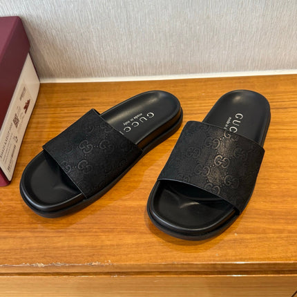 GG SLIDES IN BLACK SUEDE WITH EMBOSSED LOGO