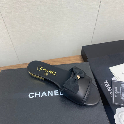 BOW SLIPPERS IN BLACK LAMBSKIN