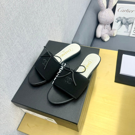 BOW SLIPPERS IN BLACK LAMBSKIN