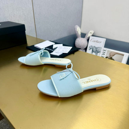 BOW SLIPPERS IN LIGHT BLUE LAMBSKIN