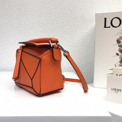 LOE MINI 18 PUZZLE BAG IN VIVID ORANGE CALFSKIN