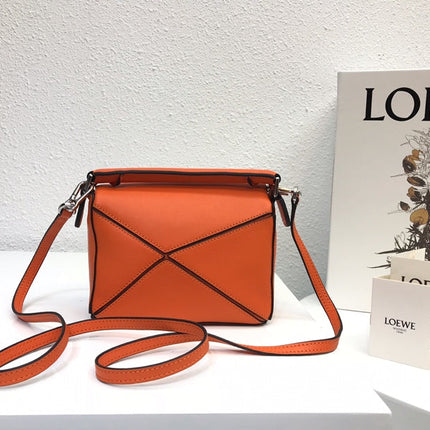 LOE MINI 18 PUZZLE BAG IN VIVID ORANGE CALFSKIN