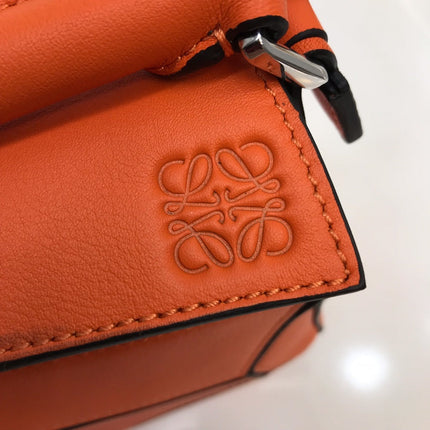 LOE MINI 18 PUZZLE BAG IN VIVID ORANGE CALFSKIN