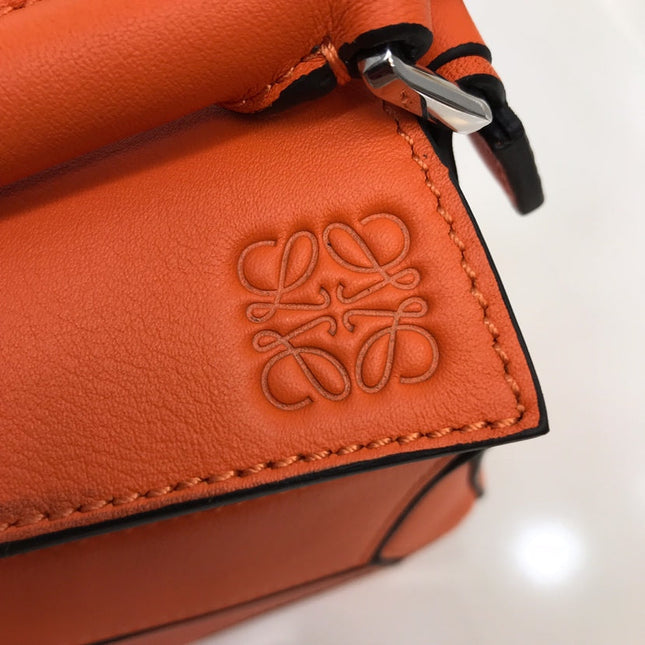 LOE MINI 18 PUZZLE BAG IN VIVID ORANGE CALFSKIN