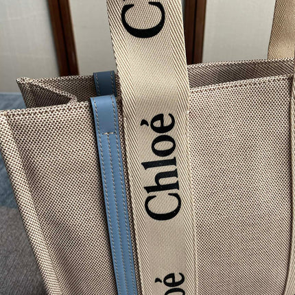 MEDIUM STRAP WOODY TOTE BAG 37 IN BEIGE LINEN CANVAS BLACK WEBBING LOGO EMBROIDER BLUE CALFSKIN