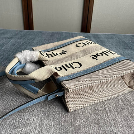 SMALL STRAP WOODY TOTE BAG 26.5 IN BEIGE LINEN CANVAS BLACK WEBBING LOGO EMBROIDER BLUE CALFSKIN