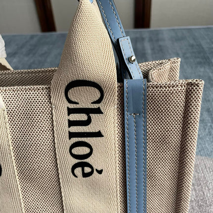 SMALL STRAP WOODY TOTE BAG 26.5 IN BEIGE LINEN CANVAS BLACK WEBBING LOGO EMBROIDER BLUE CALFSKIN
