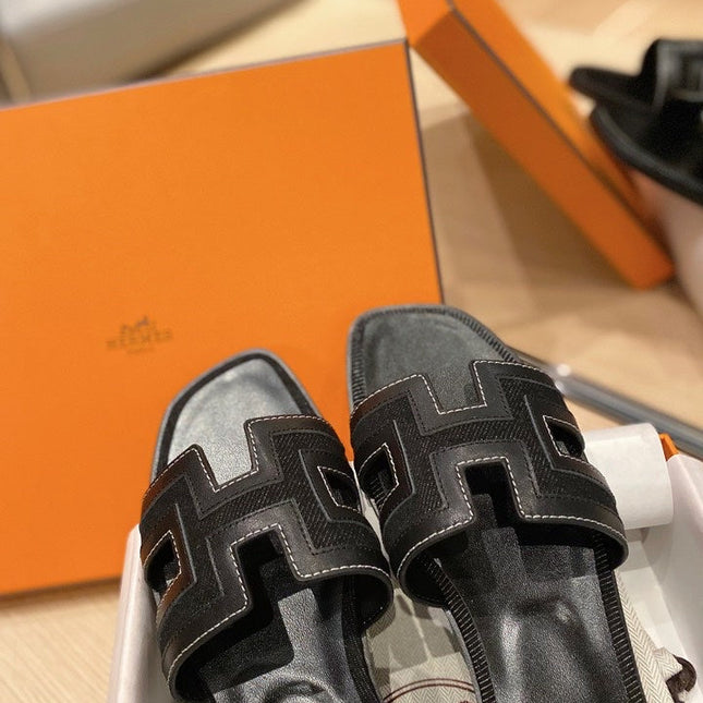 0RAN SANDALS IN BLACK CALFSKIN AND CANVAS