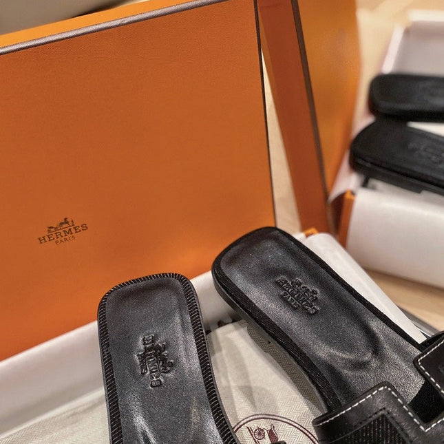 0RAN SANDALS IN BLACK CALFSKIN AND CANVAS