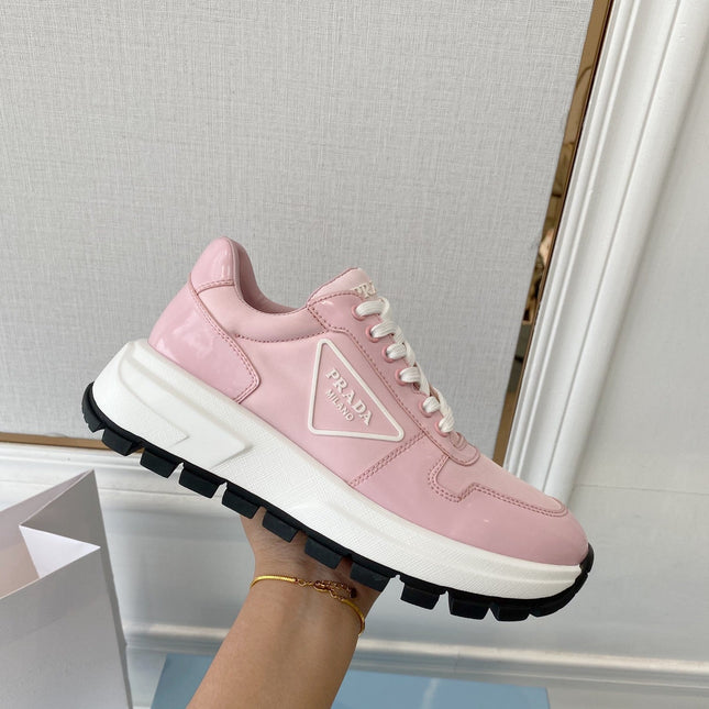 PRADA 25S THICK SOLE SNEAKER IN LIGHT PINK CALFSKIN AND CANVAS