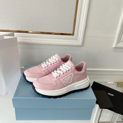 PRADA 25S THICK SOLE SNEAKER IN LIGHT PINK CALFSKIN AND CANVAS