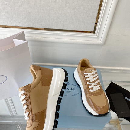 PRADA 25S THICK SOLE SNEAKER IN BROWN CALFSKIN AND CANVAS