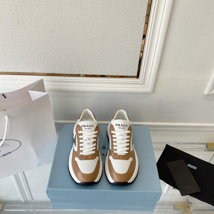 PRADA 25S THICK SOLE SNEAKER IN WHITE AND BROWN CALFSKIN