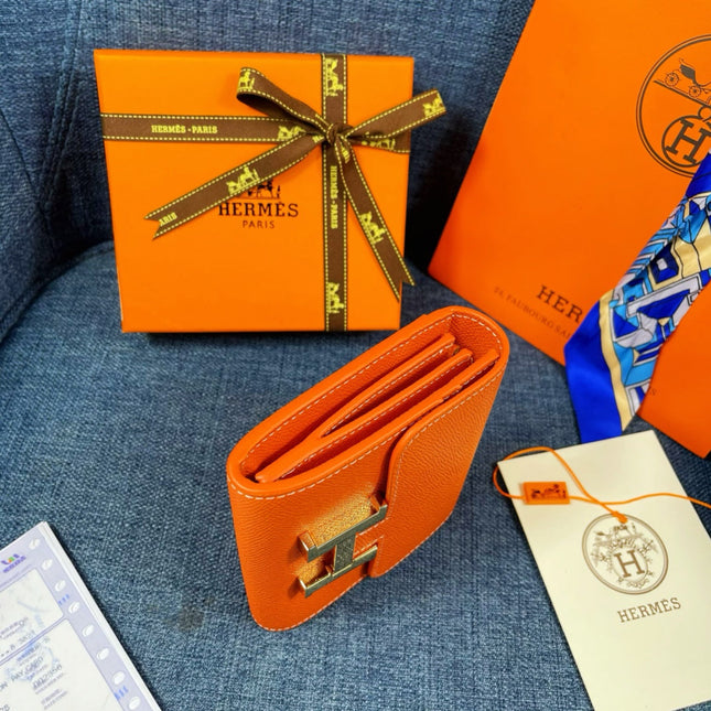 HM CONSTANCE 12 ORANGE CALFSKIN GOLD HARDWARE