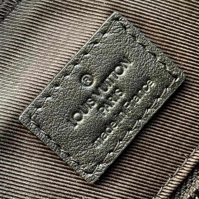 DISCOVERY BACKPACK 54 IN BLACK EMBOSSED MONOGRAM CALFSKIN